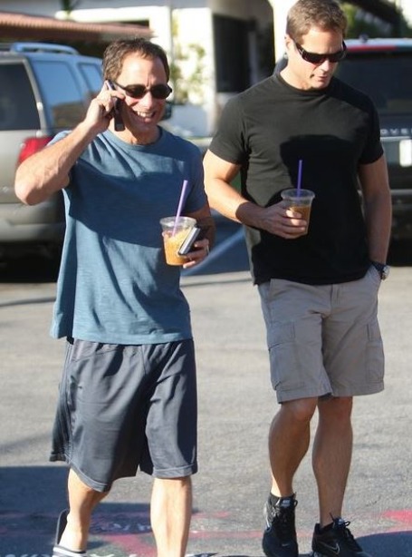 Andy Maurer and Harvey Levin going out for a walk by wearing shorts.